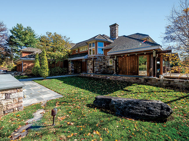 A new wing was designed to respect the rustic, vernacular nature of the existing house.
